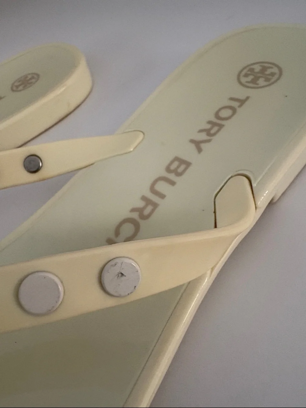 Tory Burch Ivory/pale yellow thong jelly  sandals size 7. Studded w/metal logos